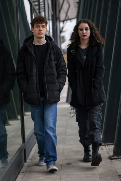 istock Duo in black walking in the urban jungle 2192494628