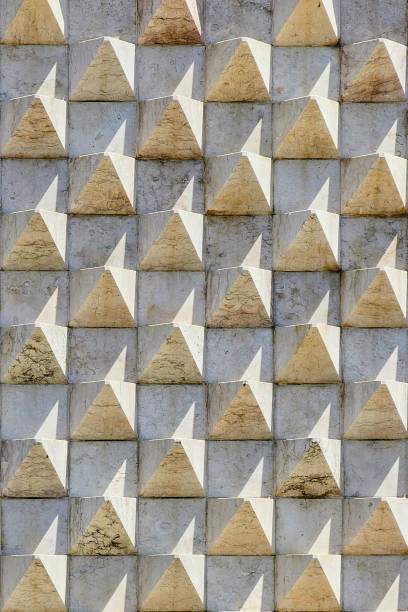 Stone triangle, abstract and modern facade of a building in Lisbon, Portugal.