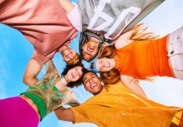 istock View from directly below of five friends in group huddle 2192496937