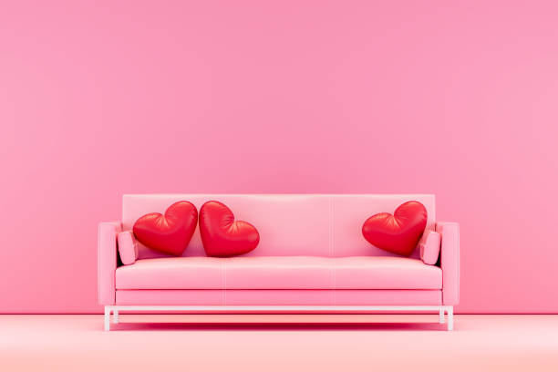 istock Valentine's Day concept with pink sofa and heart shaped pillows 2192500254