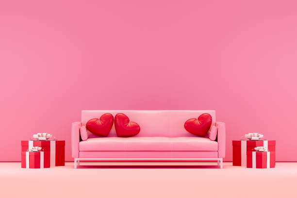 istock Valentine's Day concept with pink sofa, gift boxes and heart shaped pillows 2192500698