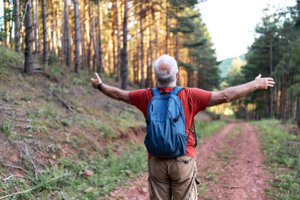 istock Senior man breathing in nature. Freedom on vacation 2192501233
