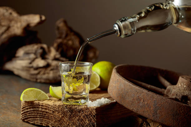 istock Tequila is poured from a bottle into a glass. 2192501781