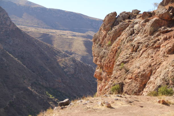 istock Rocky canyon landscape with steep cliffs and distant valleys. 2192502357