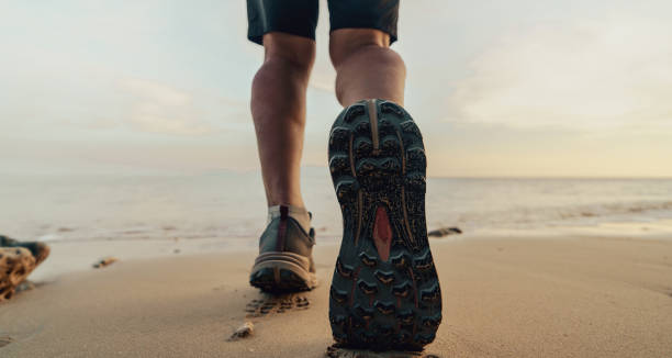 foot steps on sandy beach in tropical nature