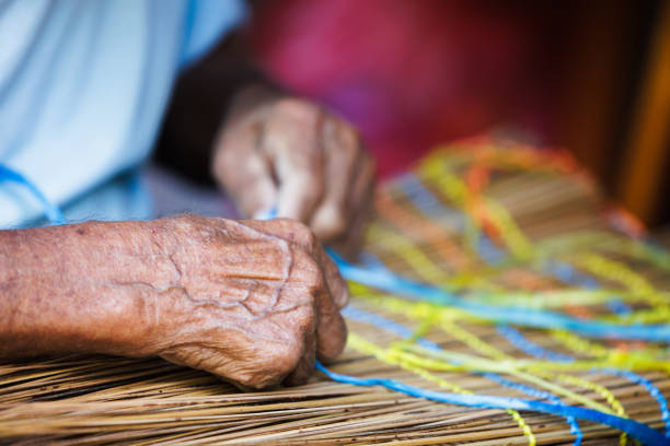 Old Man’s Hand Crafting a Traditional \