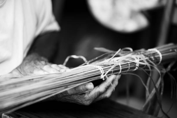 Black and white Old Man’s Hand Crafting a Traditional \