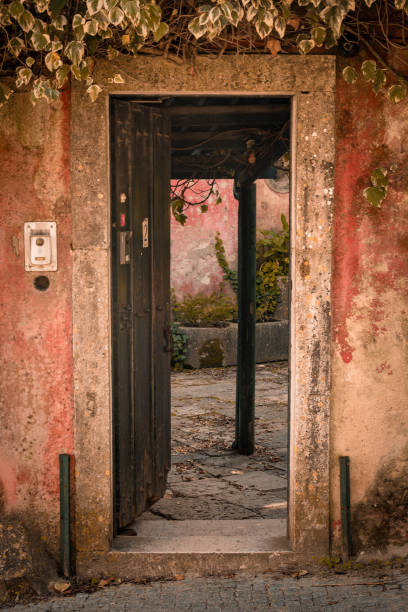 istock Stone doorway leading into an antique tiled courtyard 2192507066