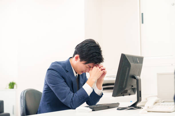 istock Businessman suffering from dry eyes in the office 2192507715
