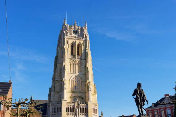 Photo of the statue of Ambiorix with in front of him the basilica our lady of Tongeren in Belgium