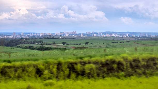 istock Urban Skyline with Green Pastures in the Foreground 2192510290