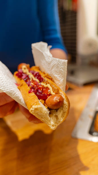 istock A Person is Holding a Hot Dog 2192510861