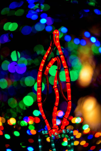 Red candle made of lights with background bokeh