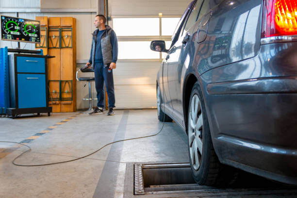 istock Car on brake tester machine. Inspection lane in car technical control station. 2192512483