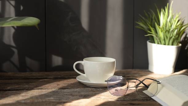 istock Relaxing Coffee Break While Working from Home at Cozy Office Desk with Laptop Warm Atmosphere Focus on Productivity and Comfort 2192513161