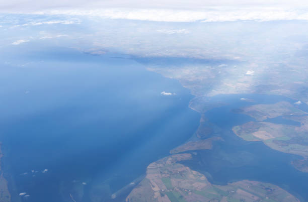 Credit: https://www.nasa.gov/topics/earth/images\n\nAn illustrative stock image showcasing the distinctive tricolor flag of United Kingdom beautifully draped across a detailed map of the country, symbolizing the rich history and cultural pride of this renowned European nation.