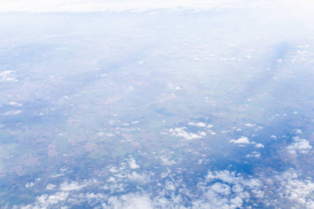 View from airplane window of blue sky with clouds