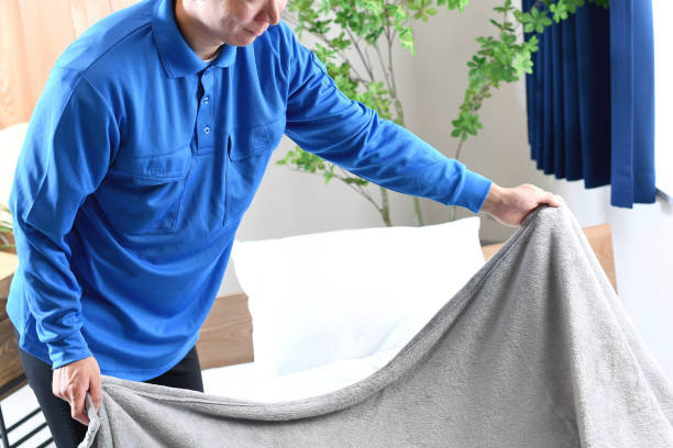 istock An Asian man who works as a house cleaner is making the bed. 2192520367