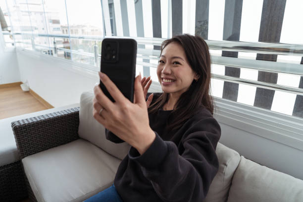 istock Smiling woman capturing a selfie with her phone 2192520392