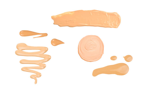 Cosmetics and beauty products on a soft towel, ready for a self-care routine.