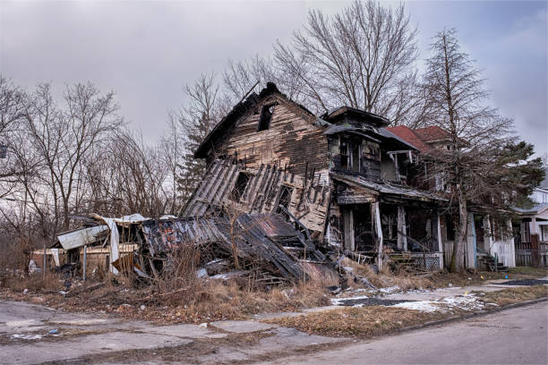 A burned house in the Highland Park neighborhood of Detroit is collpasing on top of itself.