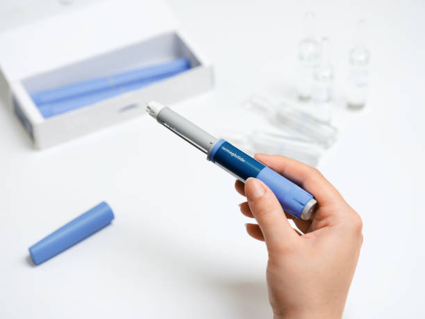 istock Female hands holding Semaglutide injection pen. 2192521478