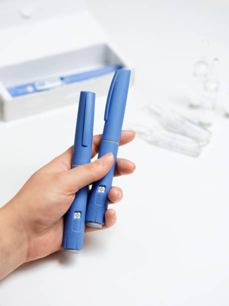istock Female hands holding Semaglutide injection pen. 2192521512