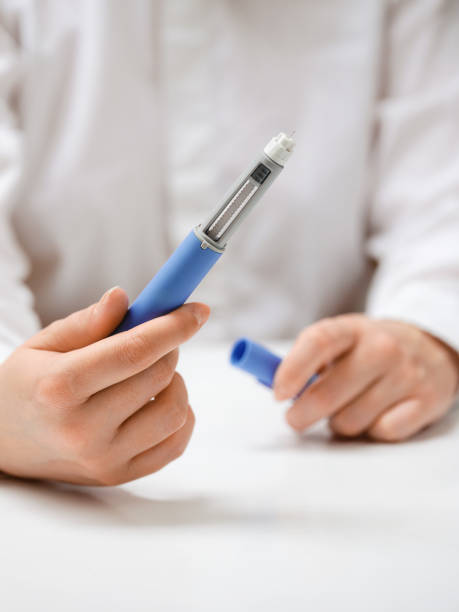 istock Female hands holding Semaglutide injection pen. 2192521564