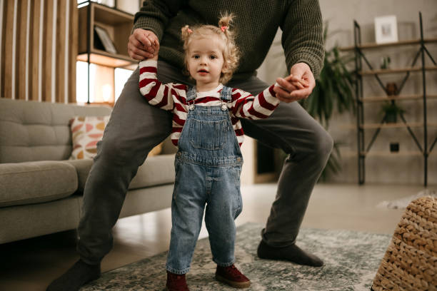 istock Young father is playing with his baby 2192524038