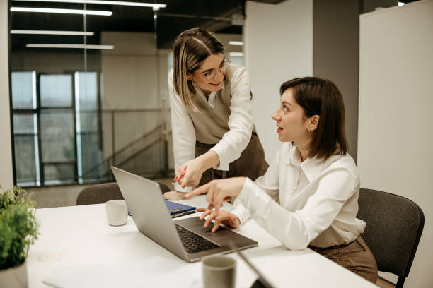 istock Two businesswomen working together in the office 2192524281