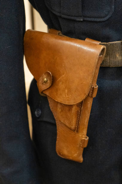 istock Leather pistol holster on the belt. 2192524848