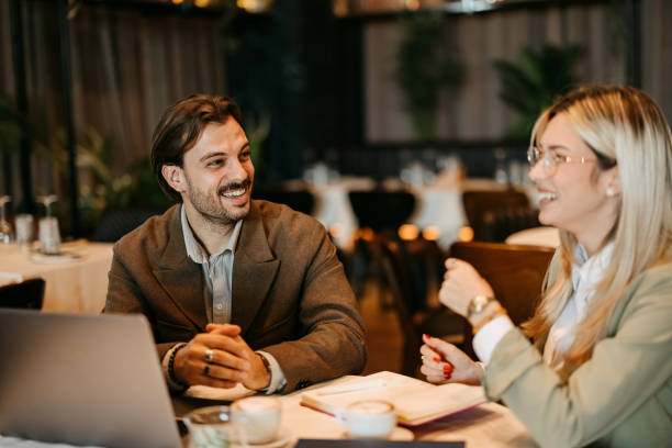 istock Coworkers talking and working in restaurant 2192525038