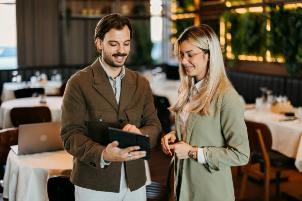 istock Man and a woman use a tablet 2192525058