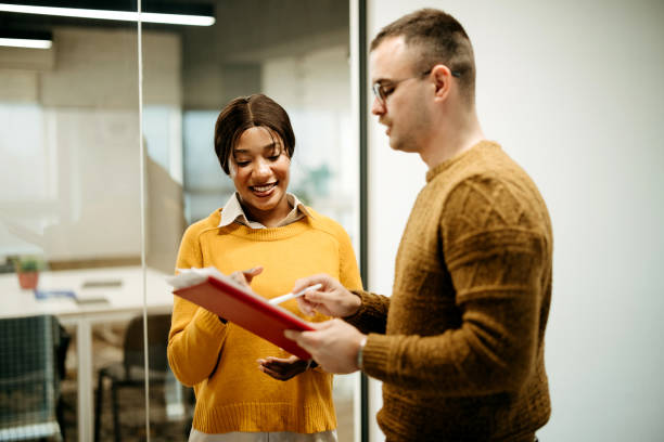 istock Colleagues in conversation in a modern office space 2192526731