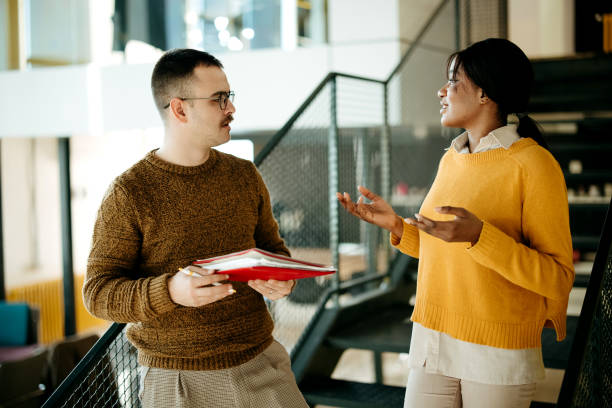 istock Colleagues in conversation in a modern office space 2192526732