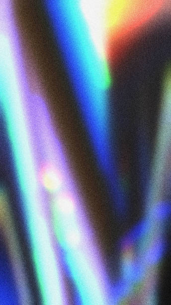 istock Abstract Gradient Background Of Iridescent Streaks Of Light With A Grainy Texture 2192527377