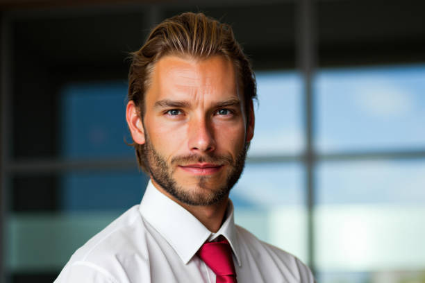 istock Businessman looking at camera with confidence in modern office 2192528227