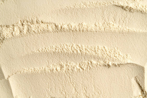 Background made of whey protein powder - nutritional supplement