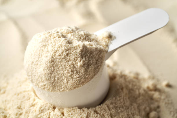 istock Whey protein powder in a measuring cup 2192528370