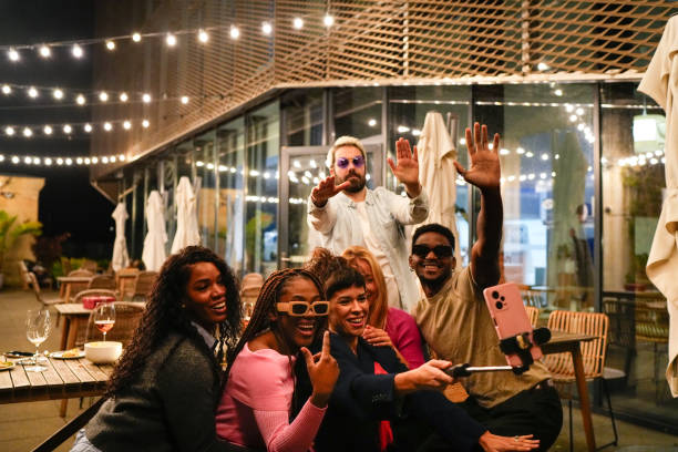 istock Multiethnic friends taking selfie at rooftop party 2192532082