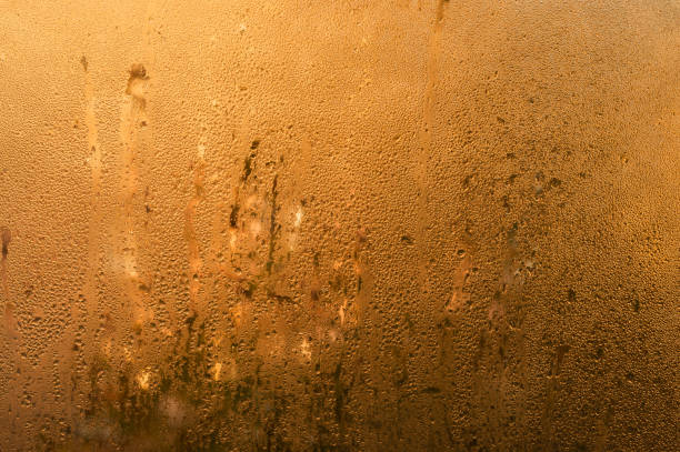 wet glass. abstract brown background