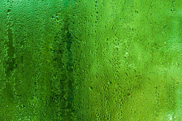 istock green wet glass with water droplets 2192535657