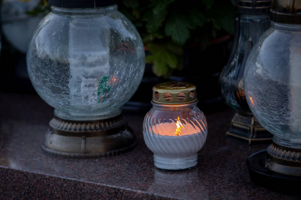 The Illuminated Memorial Lanterns Set Against a Rainy Atmosphere Create a Poignant Scene