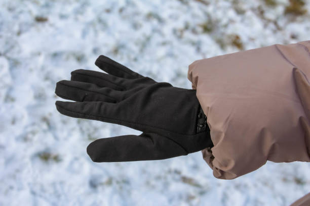 istock Winter hand reaching for warmth in snowy outdoor environment 2192539196