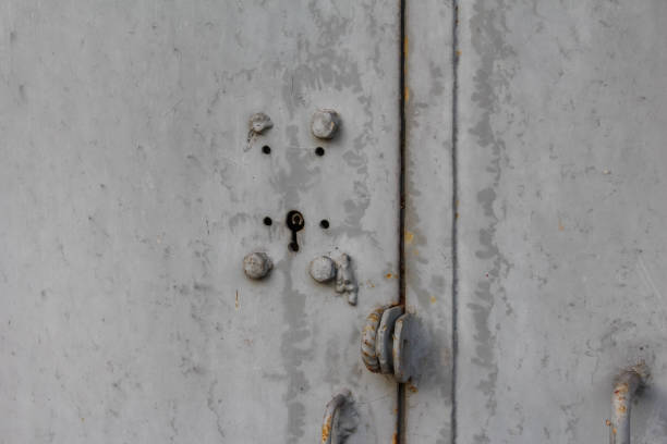 istock Rusty door lock and weathered metal surface in an outdoor setting 2192539397