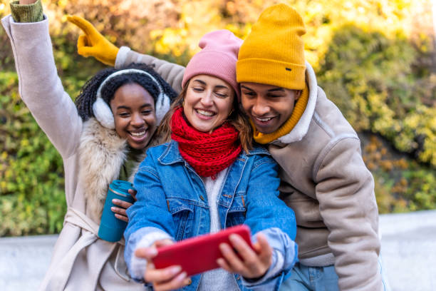istock Young friends taking selfie outside during winter day 2192541232