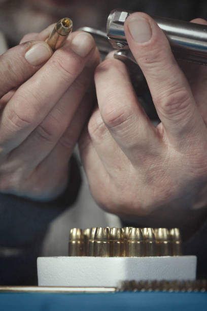 istock Checking, cleaning and loading of small derringer .38 special handgun by man 2192541485
