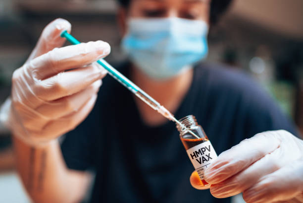 istock holding the HMPV vaccine vials 2192542125
