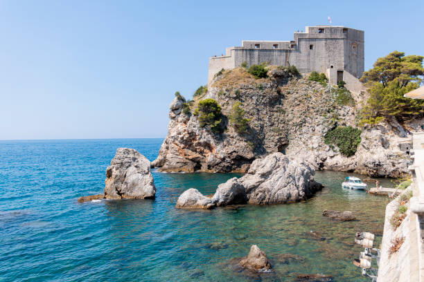 The impressive Fort Lovrijenac, also known as St. Lawrence Fortress, stands majestically on a rocky cliff overlooking the Adriatic Sea in Dubrovnik, Croatia. A historic gem offering breathtaking views and rich history