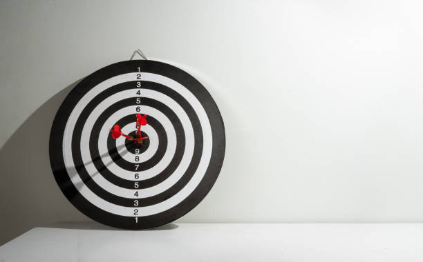 istock Three red arrows stuck in the target for copy space 2192554477
